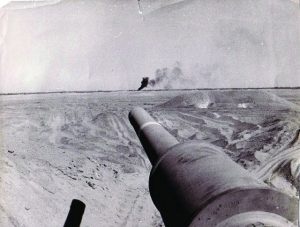 This picture shows the strength of one tank, that could hit a target from more than a kilometer away. In the picture you can see my tank cannon, and the black smoke in the background is the target we hit.