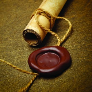 Manuscript with wax seal on a wooden table