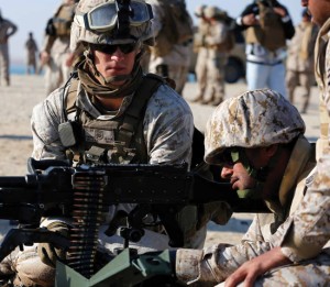 U.S. Marine Corps Lance Cpl. Riley C. Wells, center, a machinegunner with Echo Company, Battalion Landing Team 2nd Battalion, 1st Marines, 11th Marine Expeditionary Unit (MEU), and native of Grundy Center, Iowa, watches over Saudi marines as the range safety officer during bilateral machinegun live-fire training as part of exercise Red Reef 15, Ras Al Khair, Saudi Arabia, Dec. 13. U.S. military forces’ participation in bilateral exercises strengthens and demonstrates the U.S. commitment and resolve to the security and stability of the region and freedom of navigation. (U.S. Marine Corps photos by Gunnery Sgt. Rome M. Lazarus/Not Released)